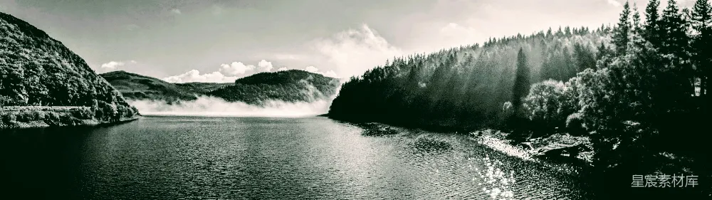 高清摄影  背景中有水、树木和山峰的身体