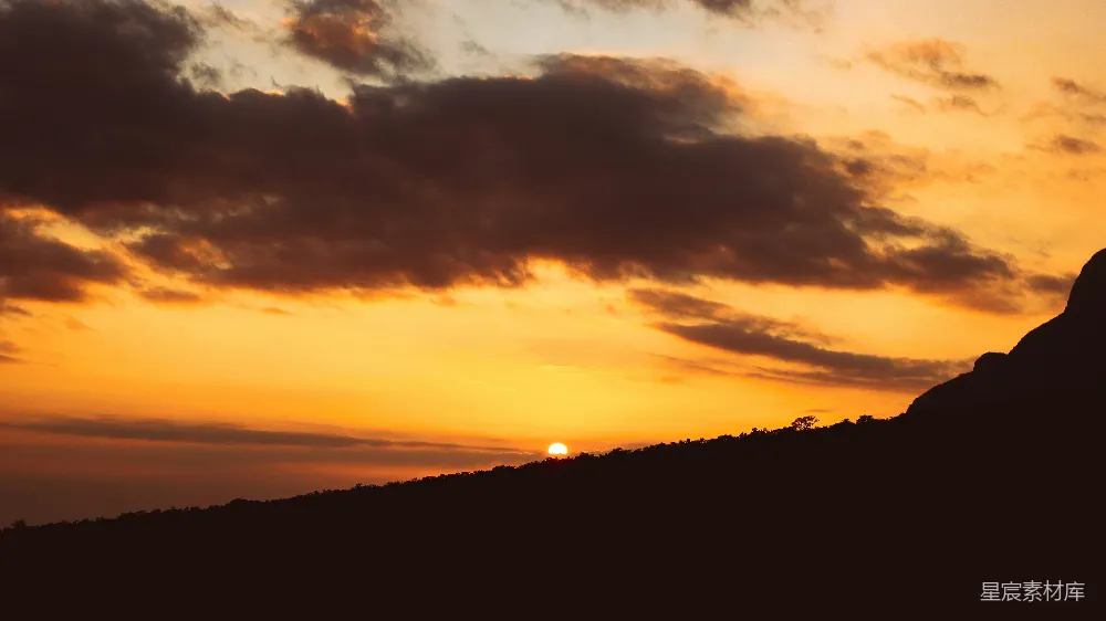 高清摄影 山峦之间夕阳的余晖