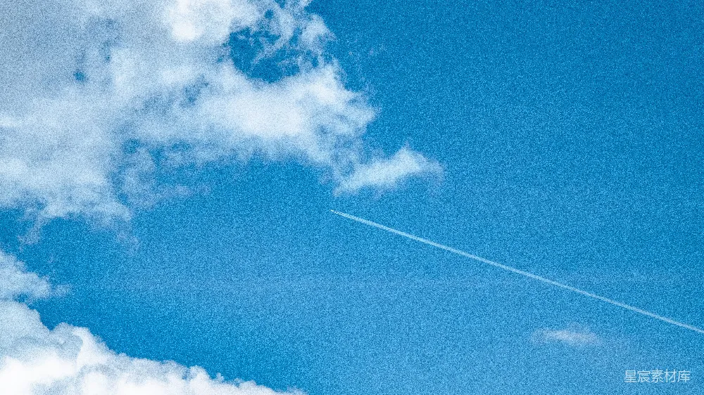 高清摄影 空中飞行的飞机，在它身后有尾迹。