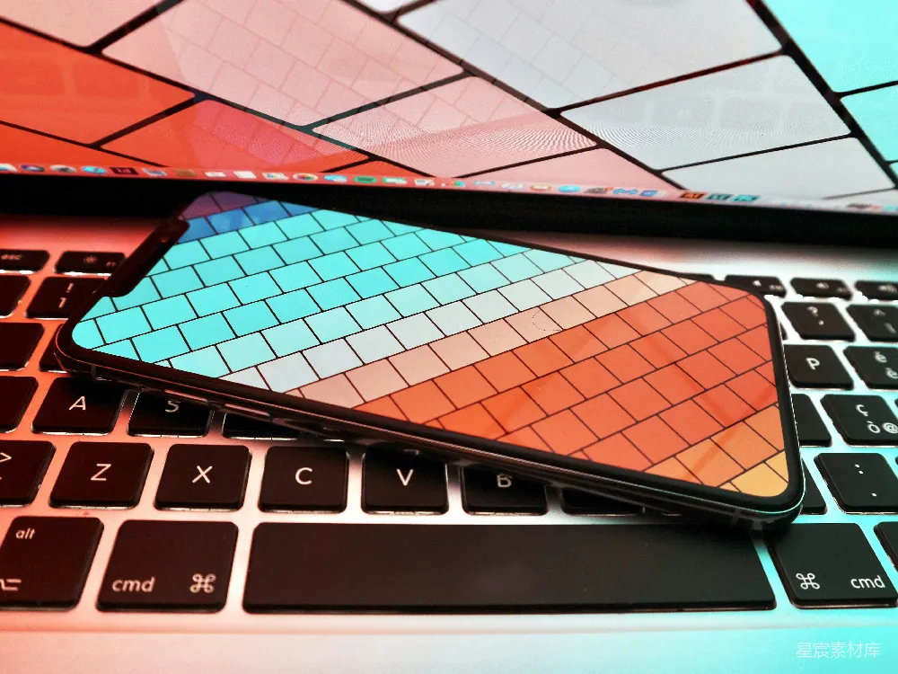 高清摄影  黑色智能手机放在MacBook Pro上