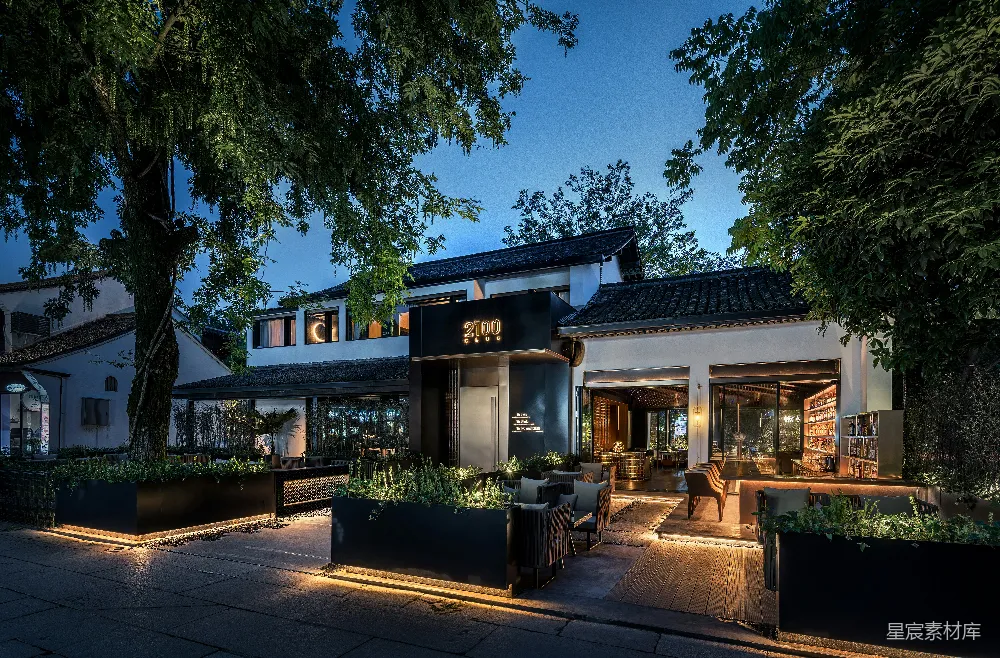 高清摄影  树旁的一间灯火通明的房子