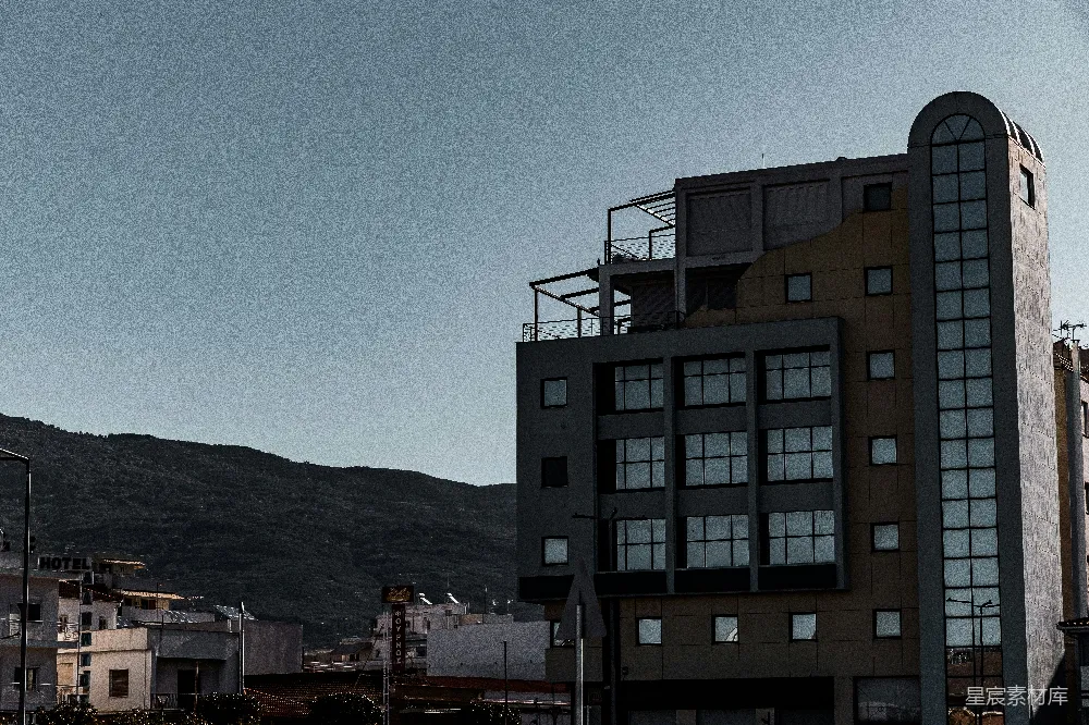 高清摄影  现代建筑与山脉背景