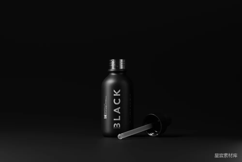 高清摄影  一个黑色的瓶子，带有黑色瓶盖和银色瓶盖。