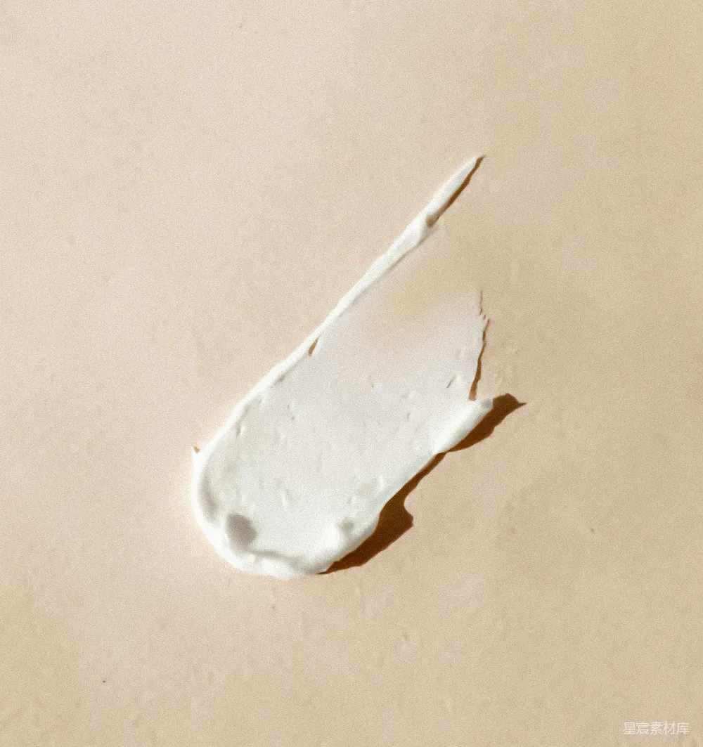 高清摄影  白色奶油涂抹在米色表面上