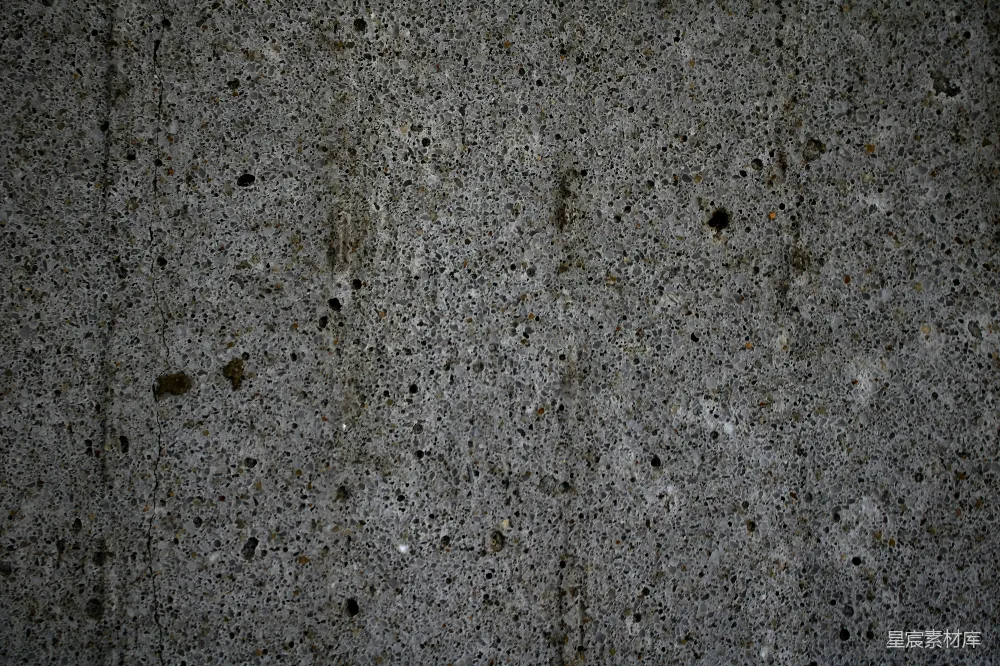 高清摄影  一堵水泥墙的特写，墙上有一些小孔。