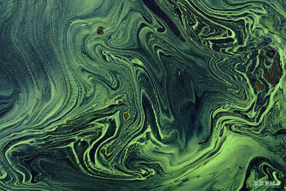 绿色和金色的湍流在黑色的画布上