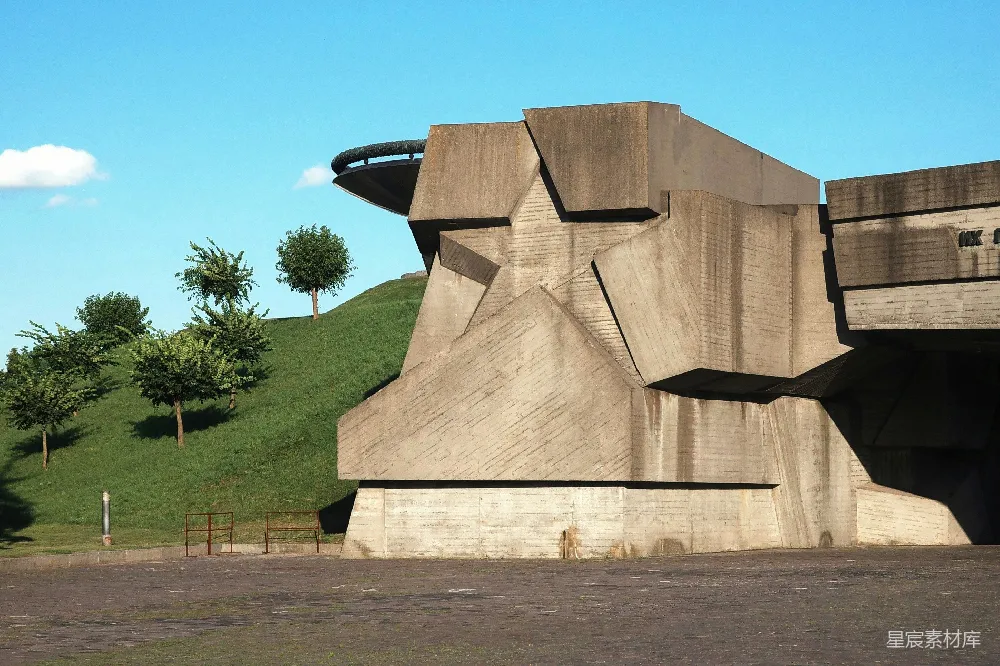 高清摄影  一座粗犷的混凝土建筑，周围有一片草地。