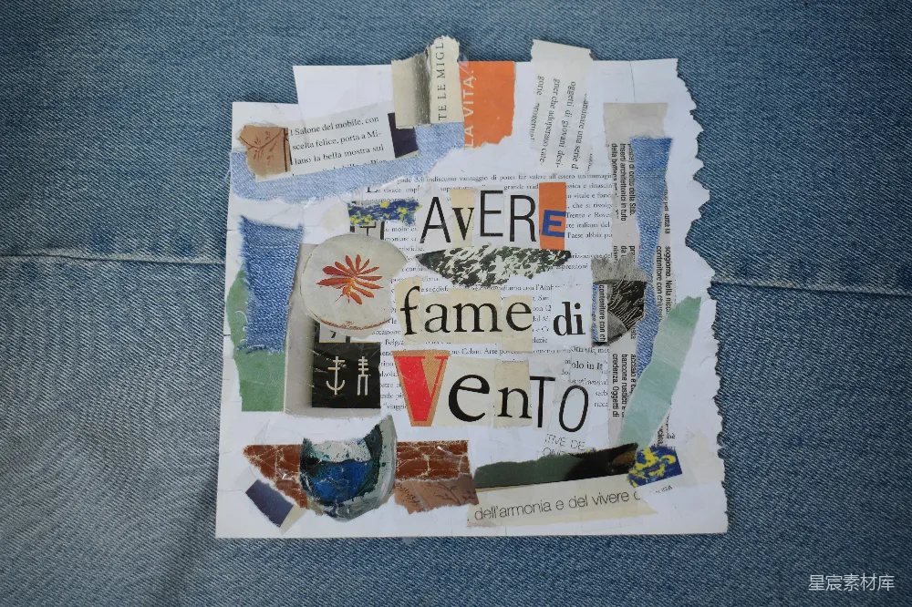 高清摄影  牛仔布上的拼贴画，上面有“avere fame di vento”（意为“渴望风”）的文字。