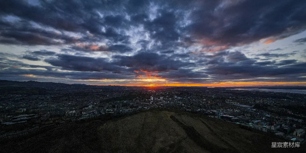 高清摄影  夕阳正在远处的城市上空落下。