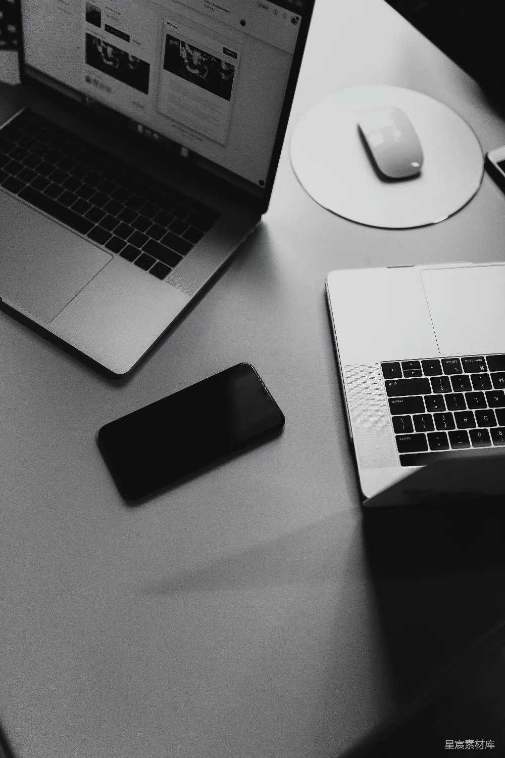 高清摄影  关闭的智能手机在MacBook之间