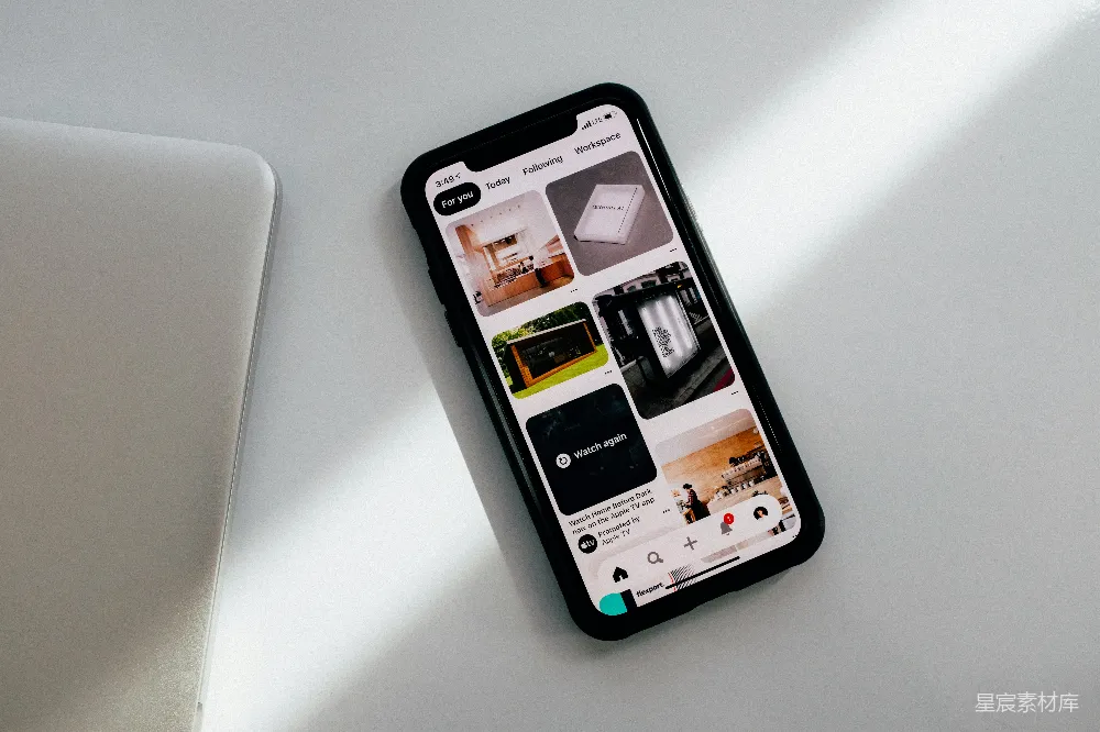 高清摄影  黑色的iPhone 5放在白色的桌子上