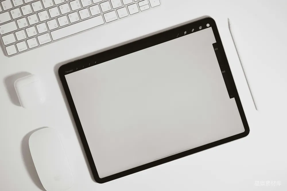 高清摄影  黑色iPad放在白色桌子上