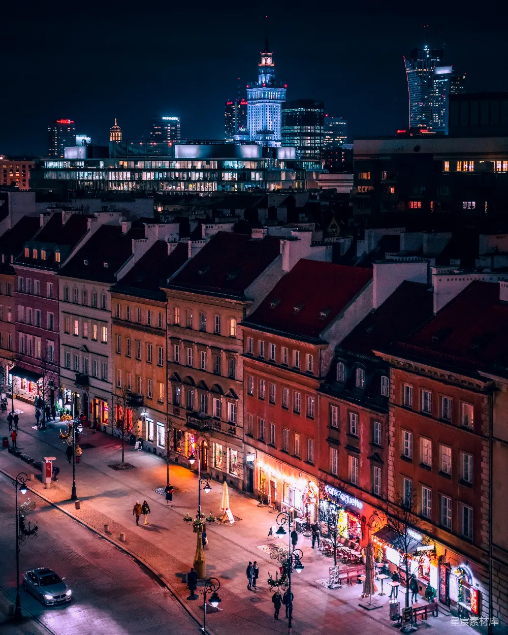 高清摄影 壁纸 一座夜晚灯火辉煌的城市，有许多高楼大厦。