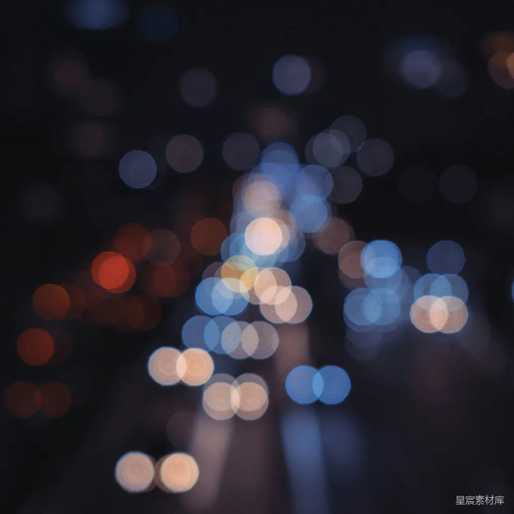 高清摄影 壁纸 一张夜晚城市街道的模糊照片