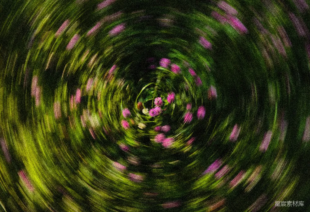 高清摄影  模糊的绿色和粉色花卉漩涡。