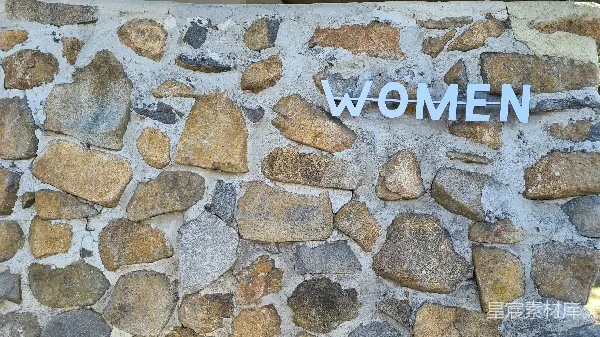 高清摄影 石墙上的女性标识