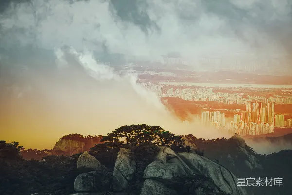 高清摄影 灰黑色的山在白云中映衬着白天的景象