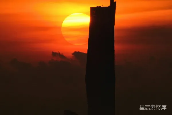 高清摄影 夕阳落在一座高楼后面