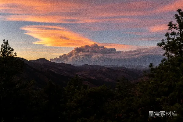高清摄影 山峦夕照景象，天空中云彩缭绕