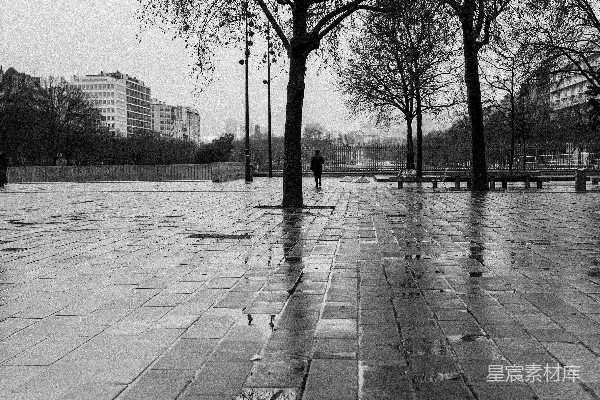高清摄影 一幅黑白照片中一个人在雨中行走