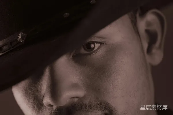 高清摄影 一幅穿 cowboy帽的男人的淡褐色肖像。