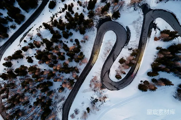 高清摄影 雪地里一条蜿蜒小路的空中俯瞰