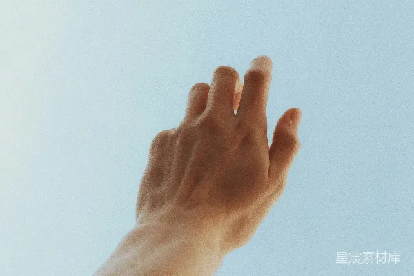 高清摄影 举左手的人