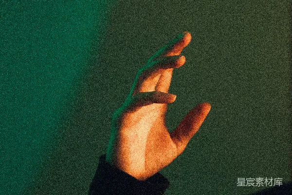 高清摄影 带有绿色背景的手
