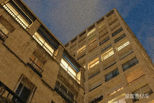 高清摄影 黄昏时分，公寓楼的窗户灯火通明。