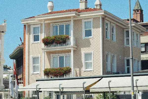高清摄影 一辆白色的汽车停在一座大型建筑的前面。