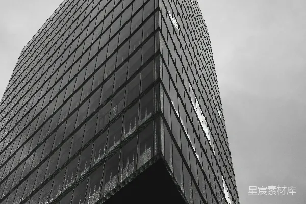 高清摄影 现代玻璃摩天大楼与多云的天空背景。