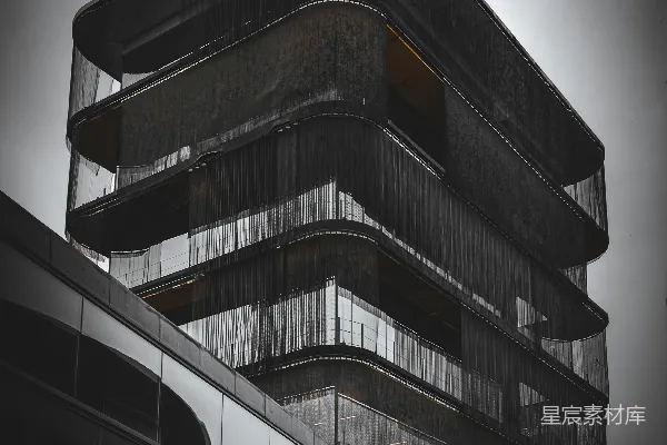高清摄影 现代化的建筑，有弧形阳台和玻璃幕墙。
