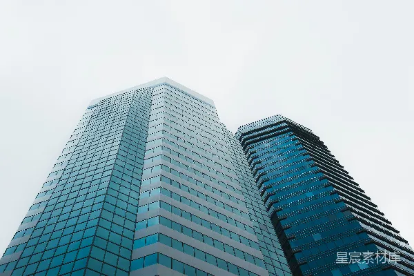高清摄影 两栋现代化摩天大楼与阴云密布的天空对比