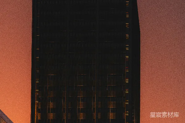 高清摄影 现代摩天大楼剪影，在绚丽的橙色夕阳背景下。