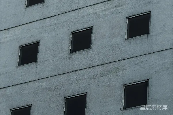 高清摄影 一排排黑色正方形窗户在混凝土建筑上。