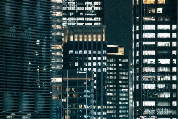 高清摄影 夜晚照亮的摩天大楼在现代化的城市中。