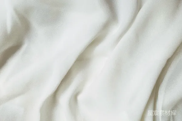 高清摄影 一张白色的床单的特写图。