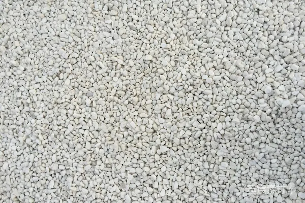 高清摄影 一张特写的白地毯，上面有小石头。