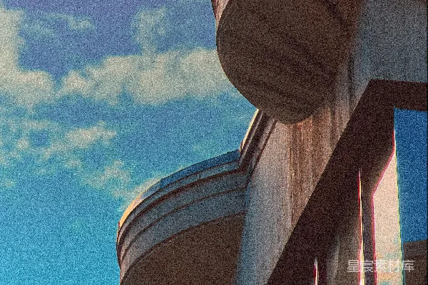 现代建筑配以弯曲的阳台面向蓝天。