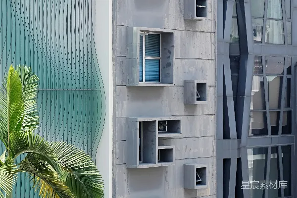 绿色棕榈树旁白色混凝土建筑