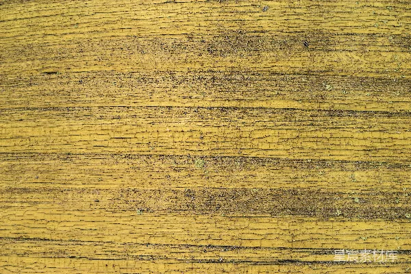 高清摄影 一张木制表面的特写，上面有黄色油漆。
