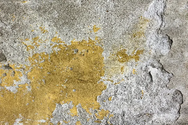高清摄影 一堵黄灰相间的墙，油漆剥落。