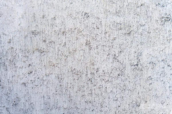 高清摄影 一张白色墙壁的特写，上面有小黑点。