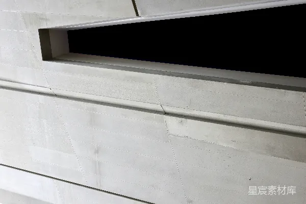 高清摄影 抽象的浅灰色纹理表面带有深色开口。