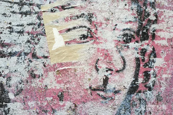 高清摄影 一幅女人脸的画挂在墙上