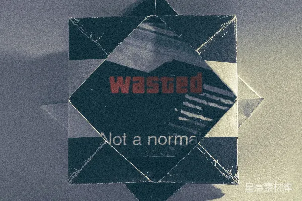 高清摄影 带有“wasted”文字的折纸星星。