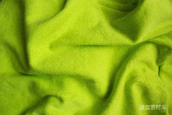 带有黑色背景的草绿色织物