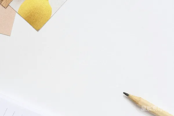高清摄影 黄色的钢笔和一个柠檬放在白色的表面上。