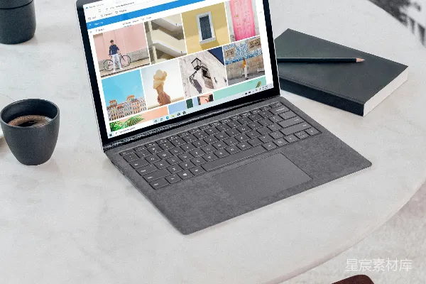 高清摄影 Microsoft Surface Laptop 3 银色版放在白色圆形桌子上