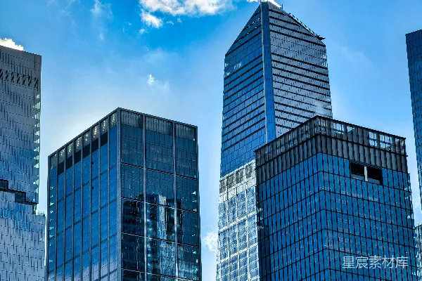 高清摄影 现代玻璃摩天大楼在晴朗的蓝天背景下